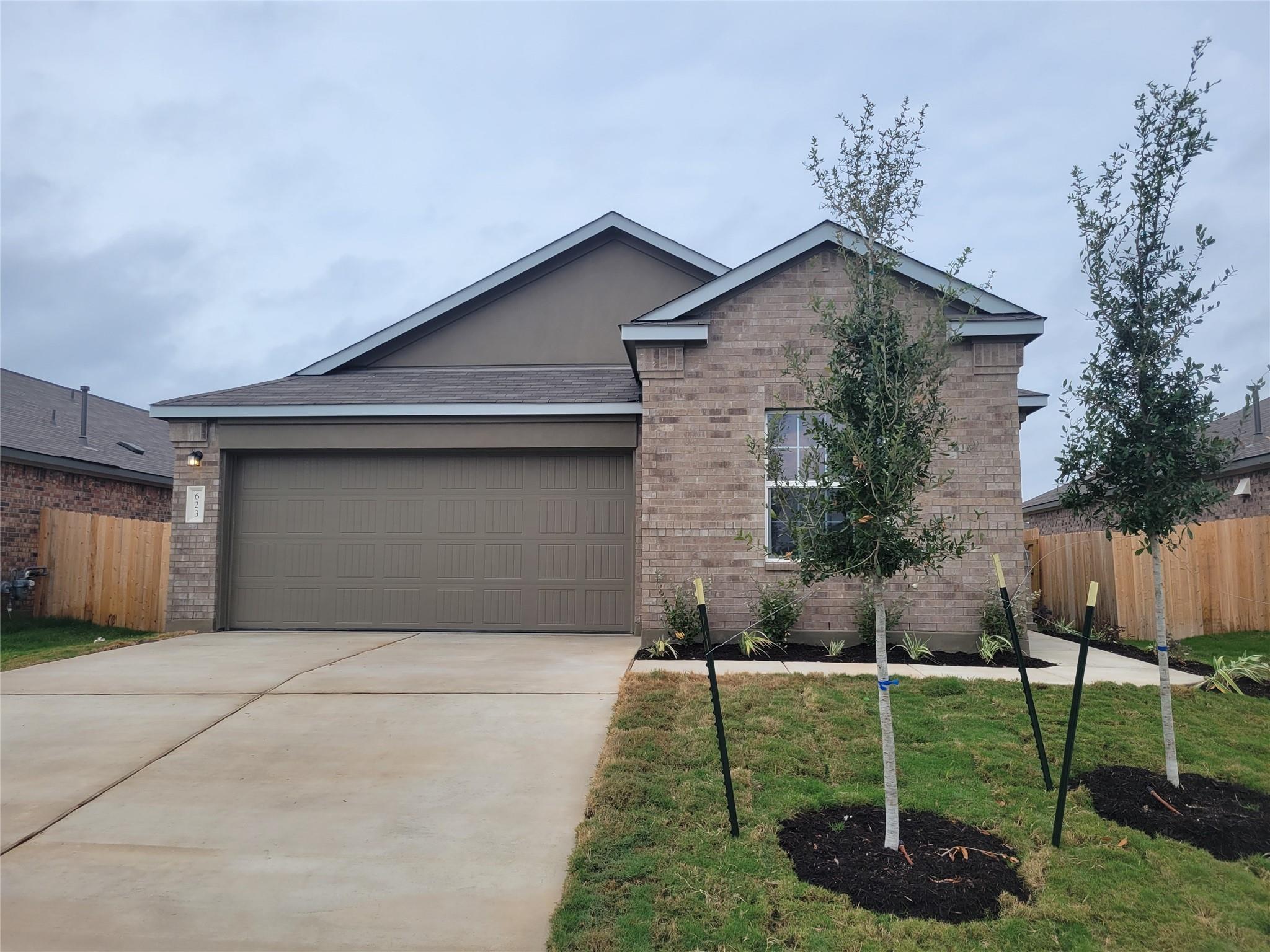 Brick and stucco finishes define this contemporar