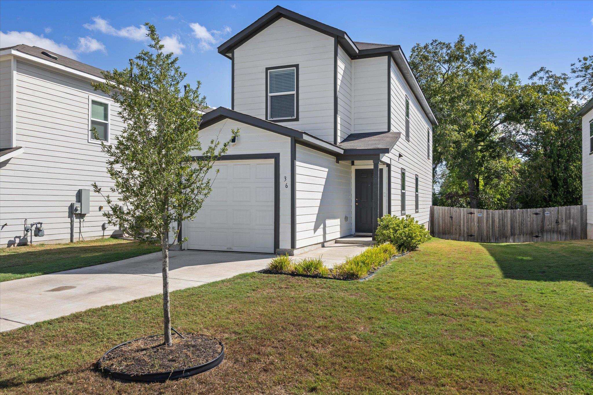 Crisp siding and sharp dark trim highlight this c