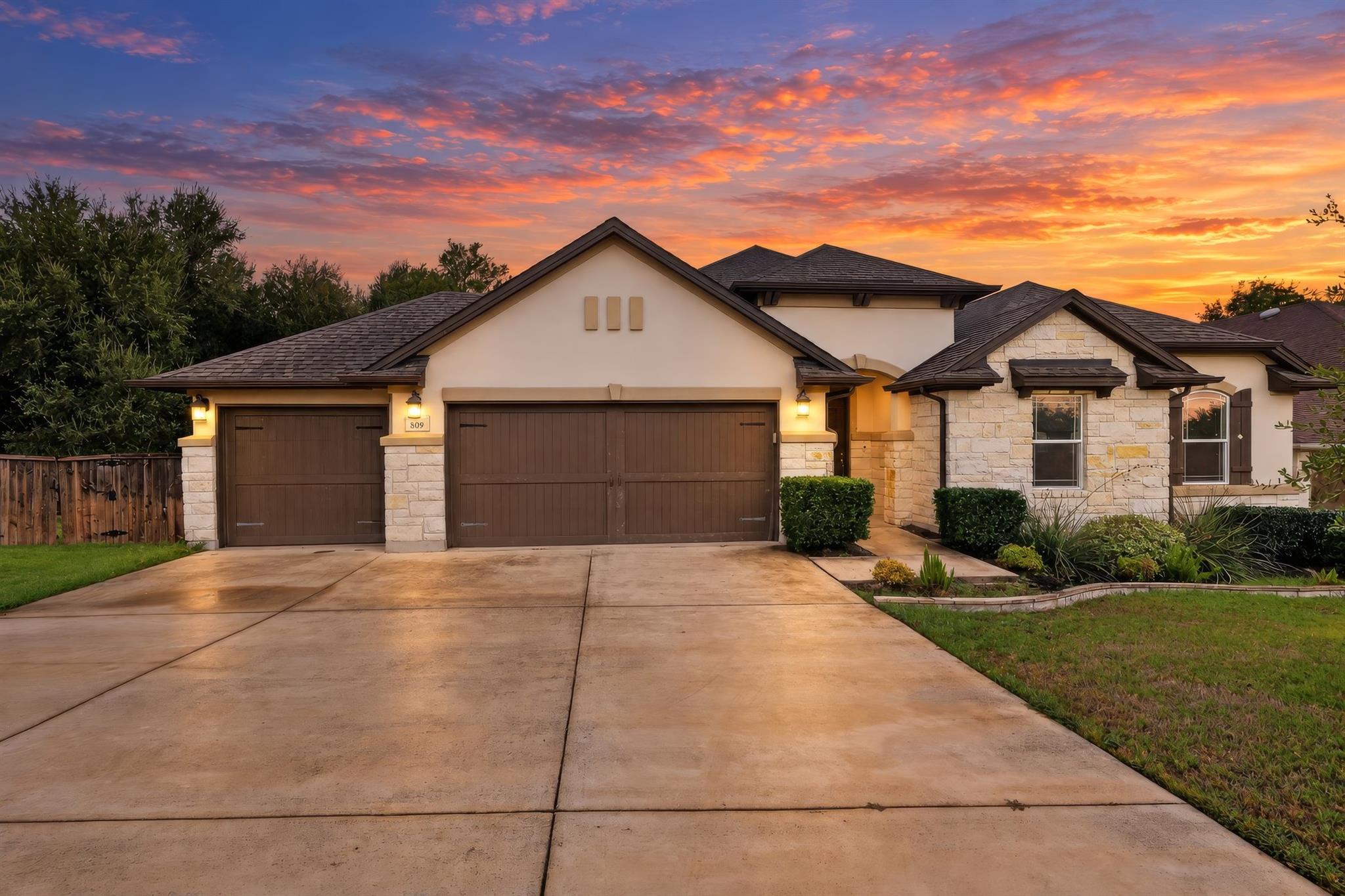 An inviting exterior balances classic stone and s