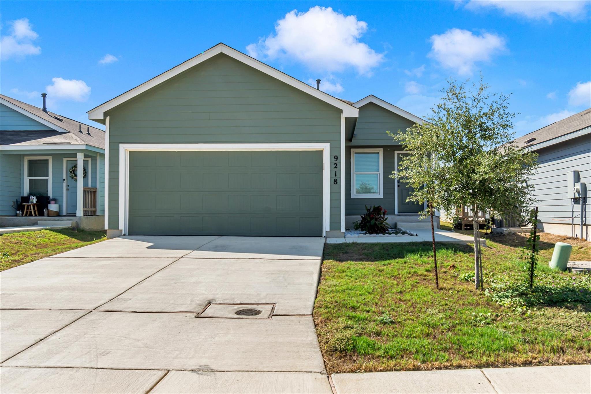 Clean lines and a spacious driveway define this m