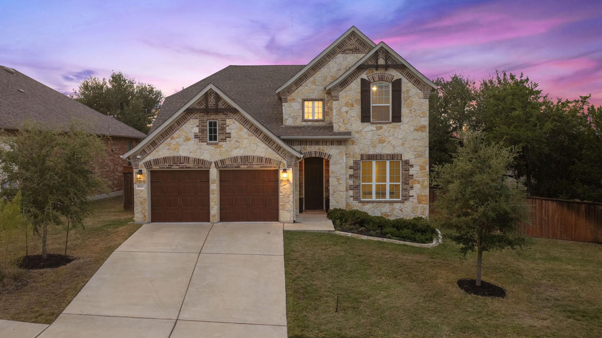 Striking stone masonry accents this two-story ext