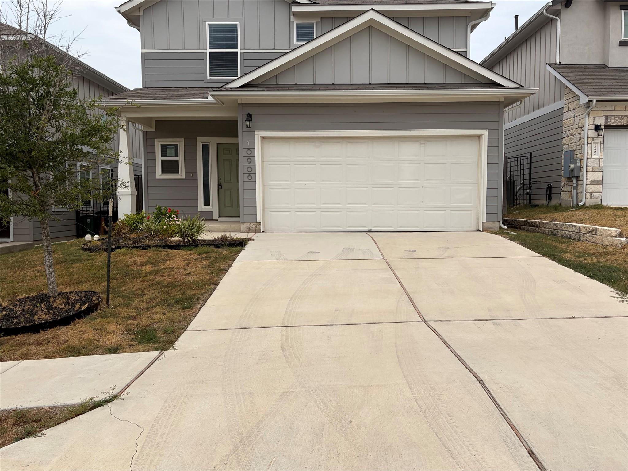Clean lines and a spacious driveway define this m