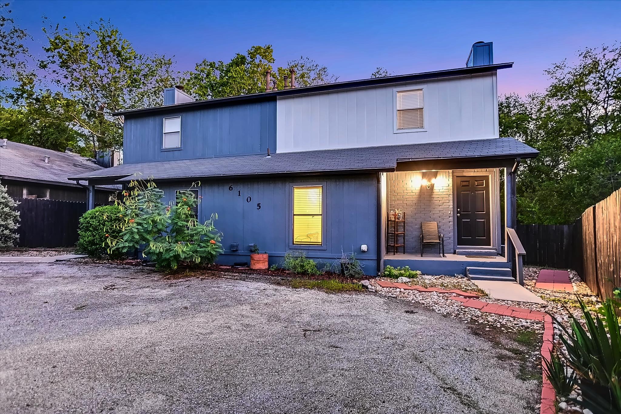 A welcoming front porch and custom exterior detai
