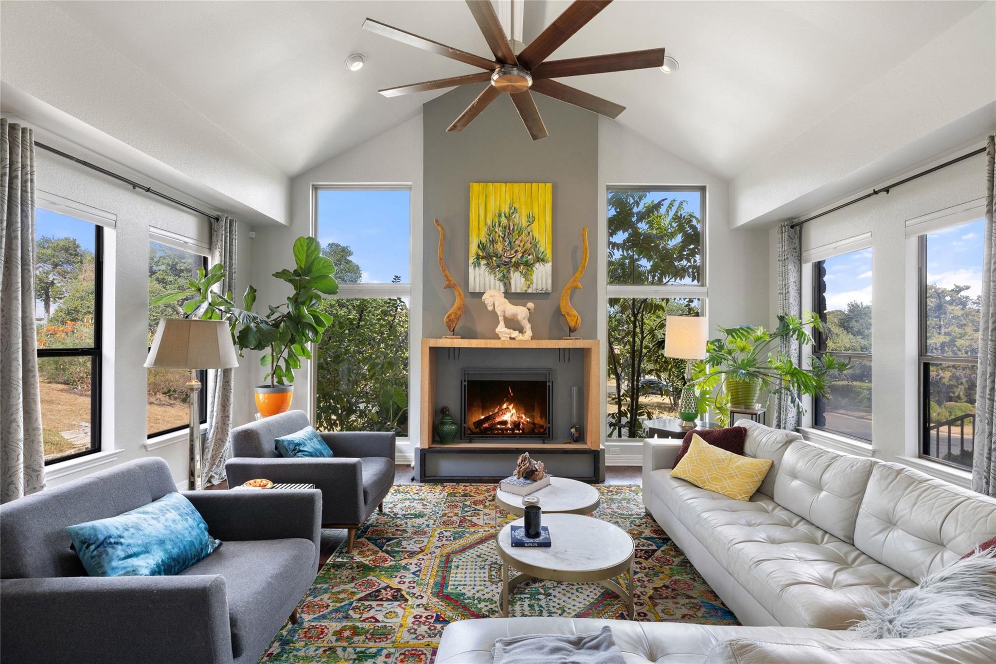 A striking fireplace accentuates vaulted ceilings