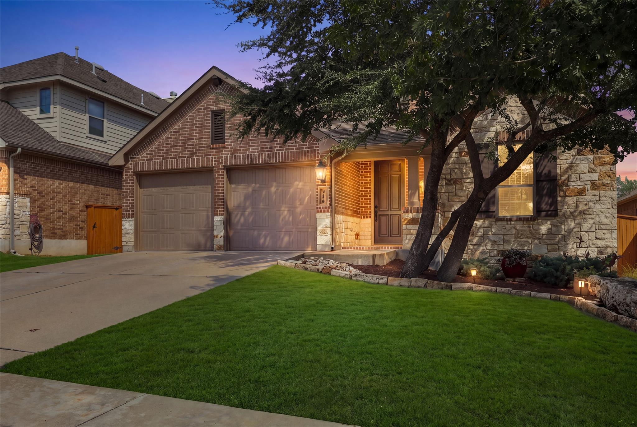 Textured stone and classic brick accent the exter