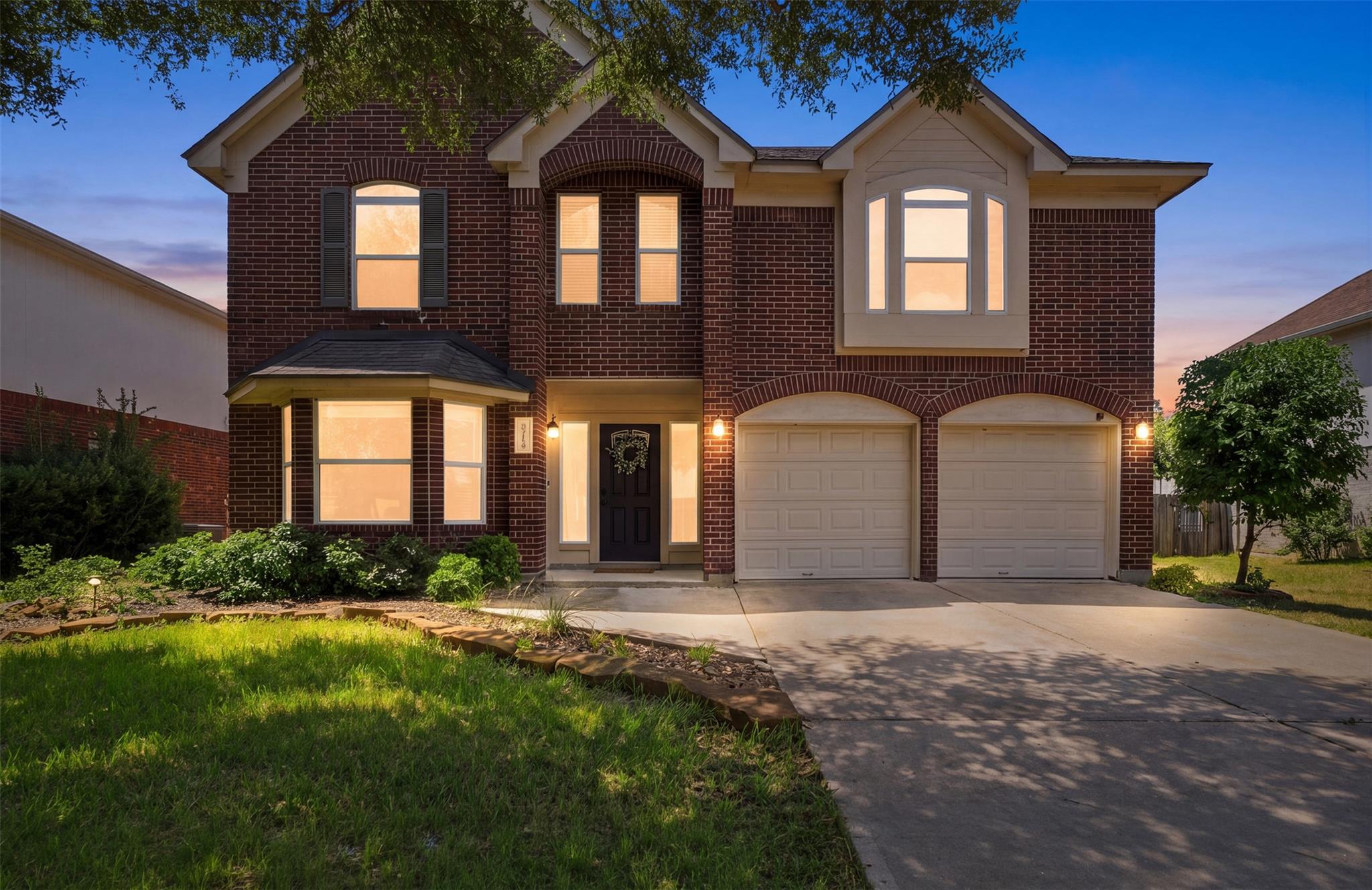Classic brick exterior shines under twilight sky 