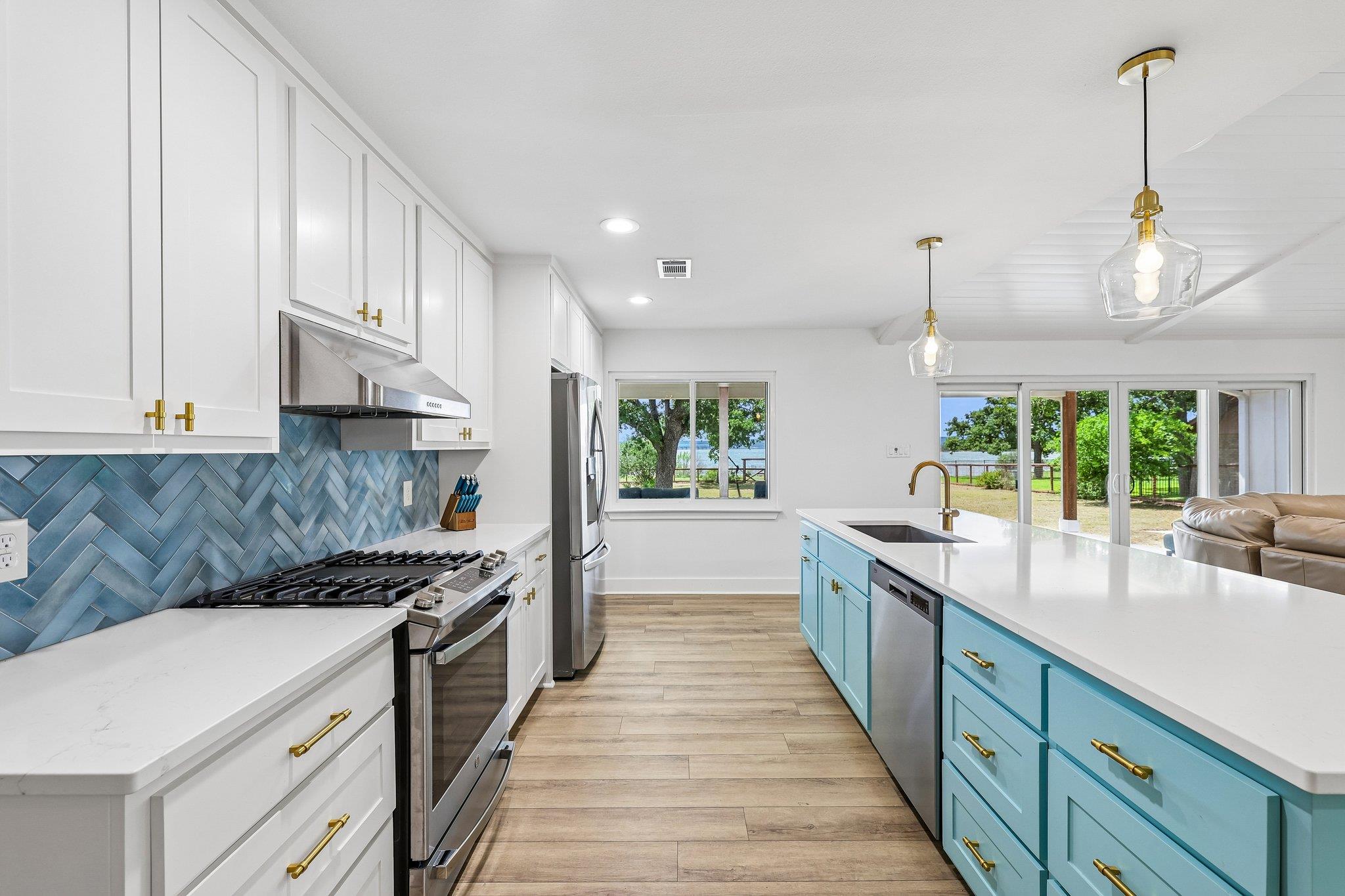 An open kitchen showcases sleek stone countertops