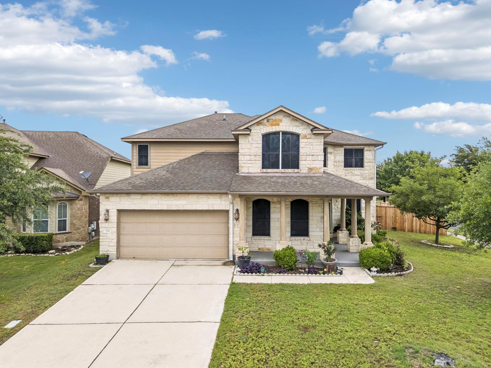 A classic stone facade and covered front entry cr