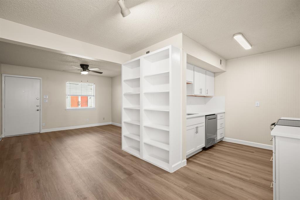 An open floorplan connects the living space and k