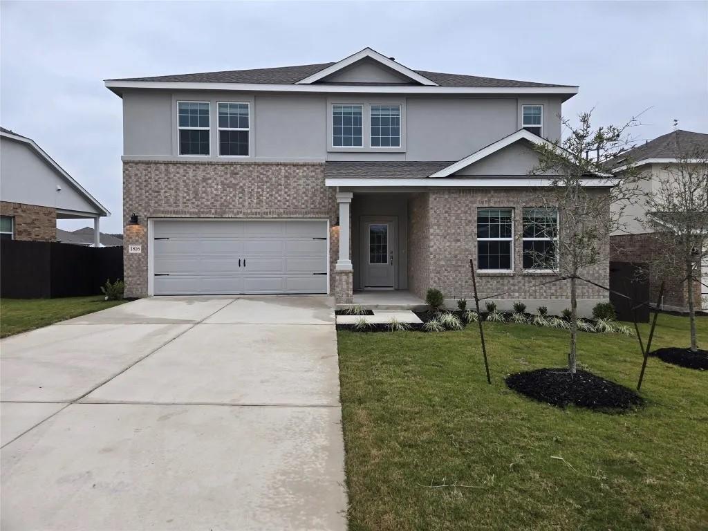 A spacious driveway leads directly to the integra