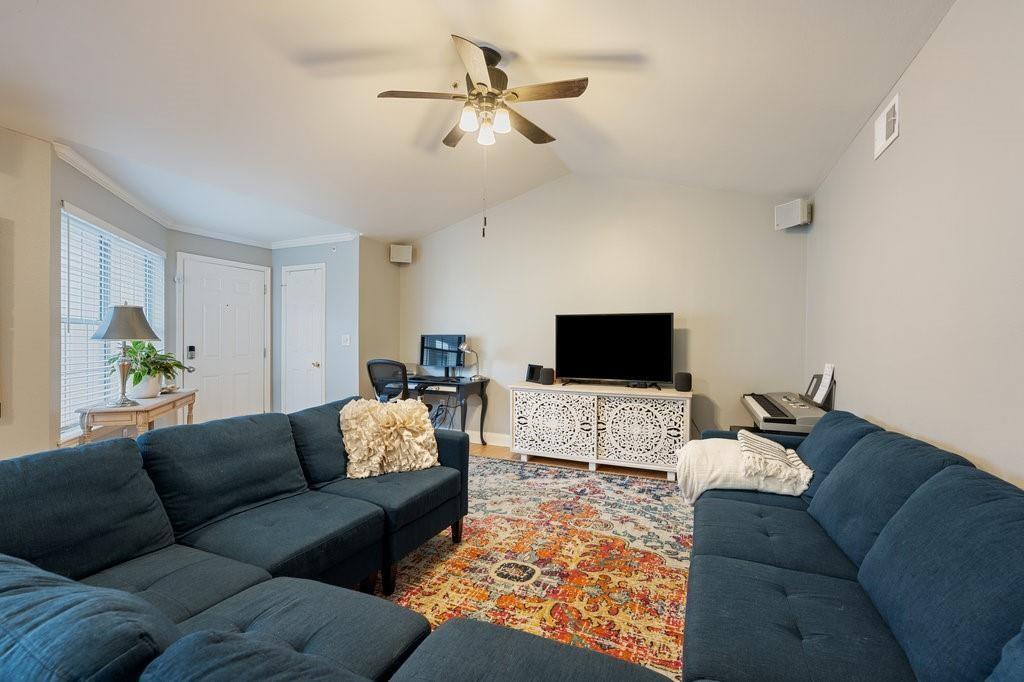 Vaulted ceilings and handsome hardwood flooring a