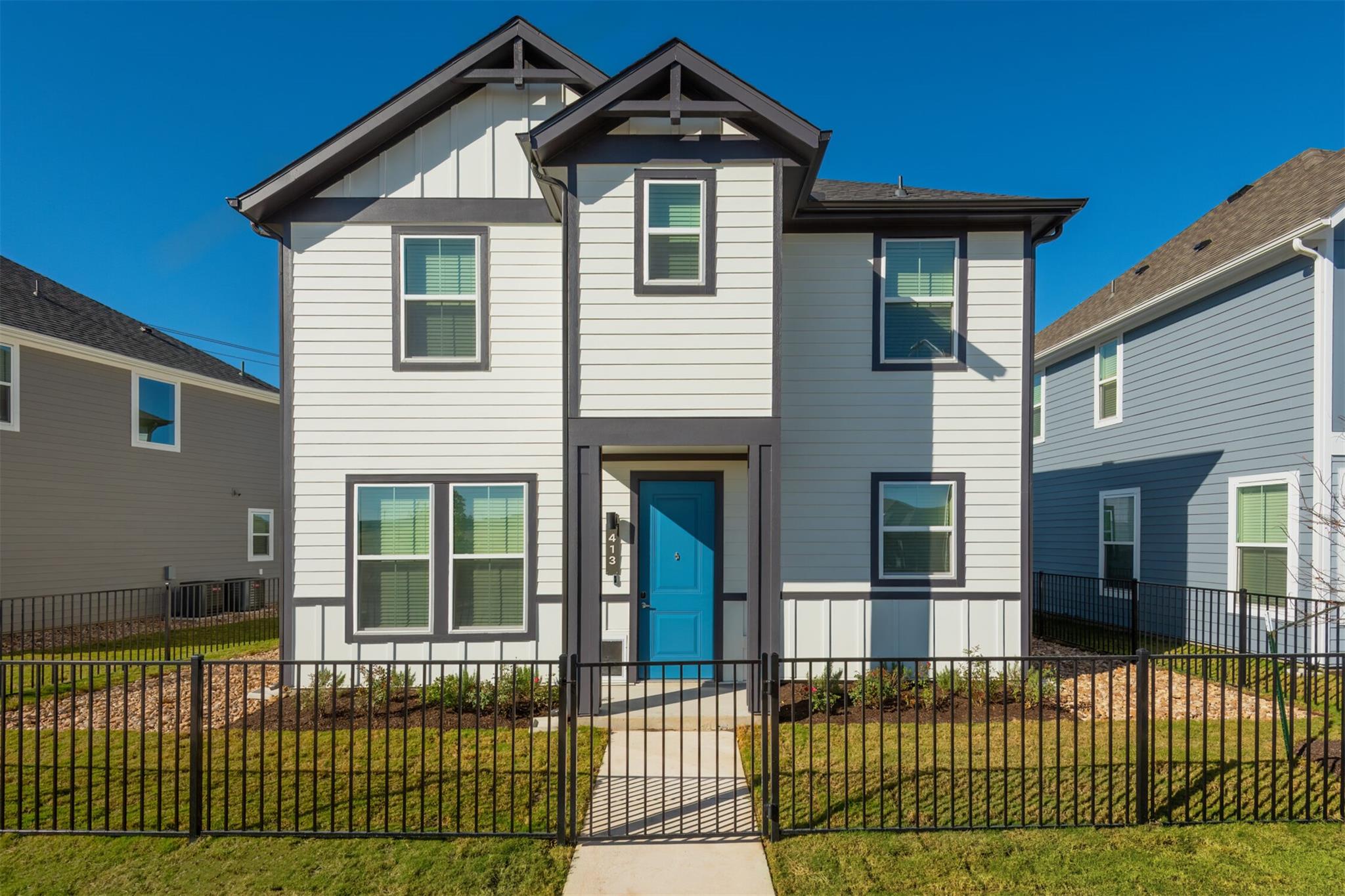 Crisp vertical and horizontal siding defines this
