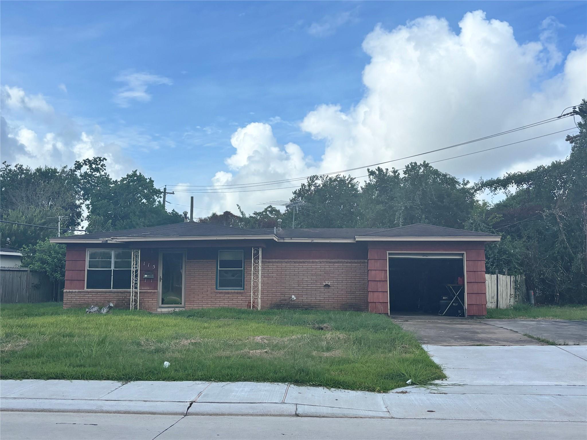 A classic brick facade and an attached garage def