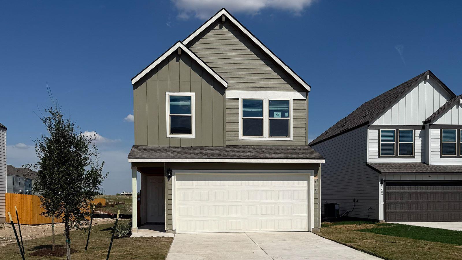 A crisp two-story facade showcases board-and-batt