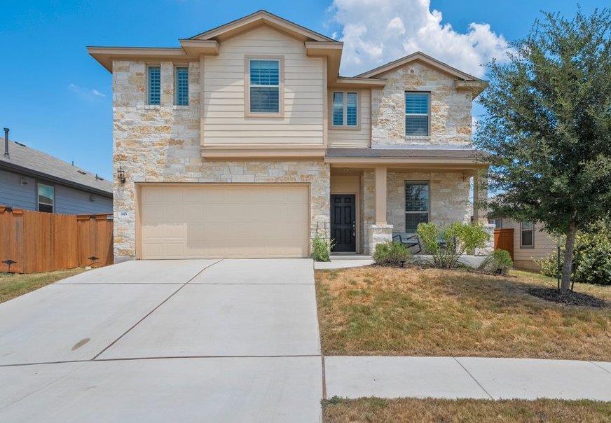 Natural stone and classic siding accent this two-