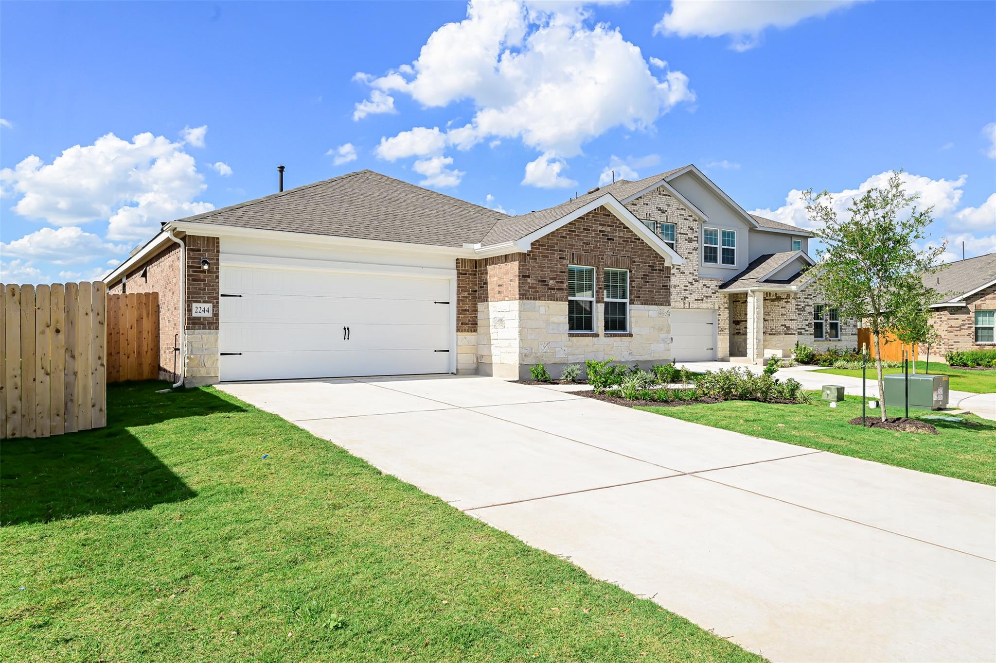View of front of house featuring driveway, an att