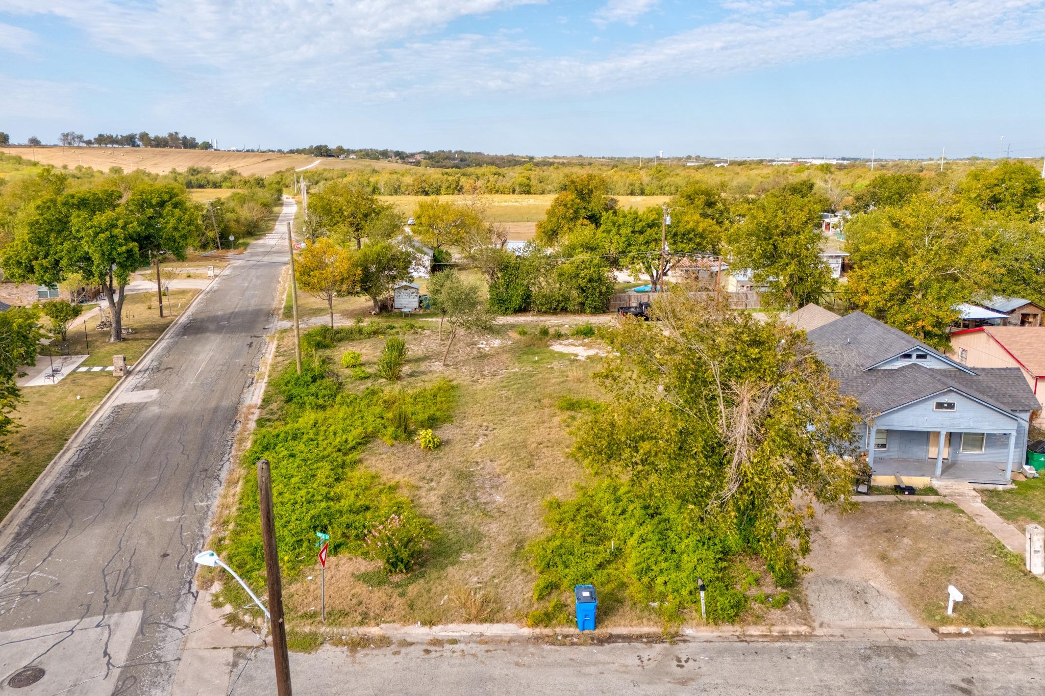 An aerial perspective showcases a spacious vacant