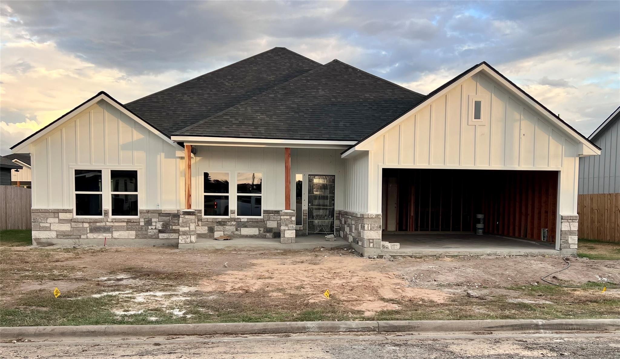 Board and batten siding pairs with classic stone 