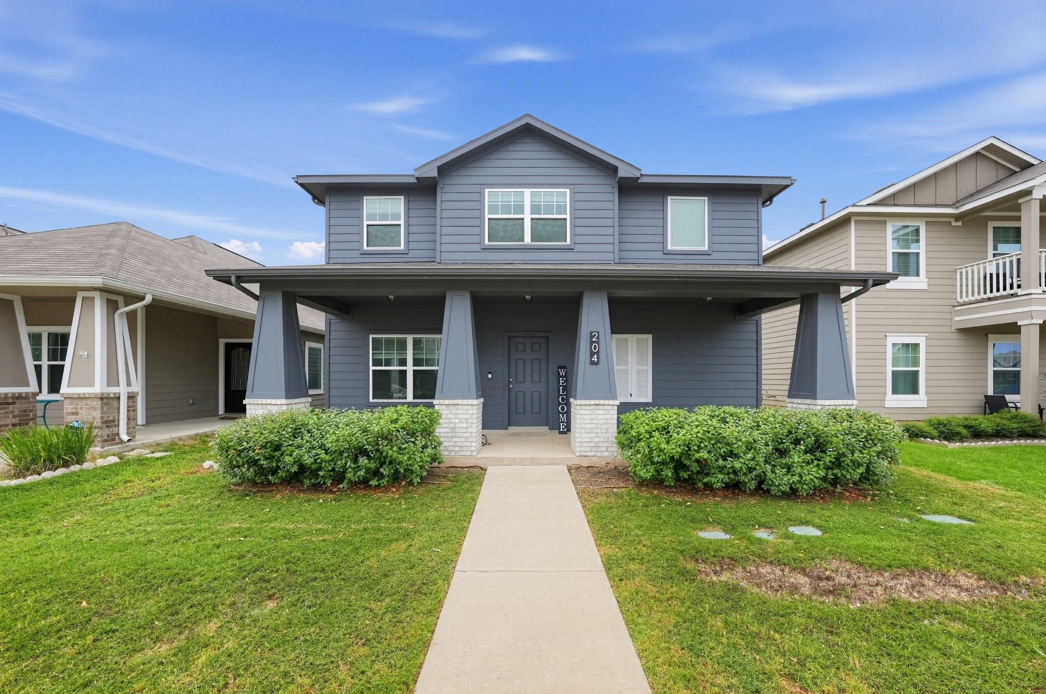A welcoming front porch with substantial columns 