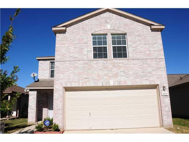 View of front of home with an attached garage, dr