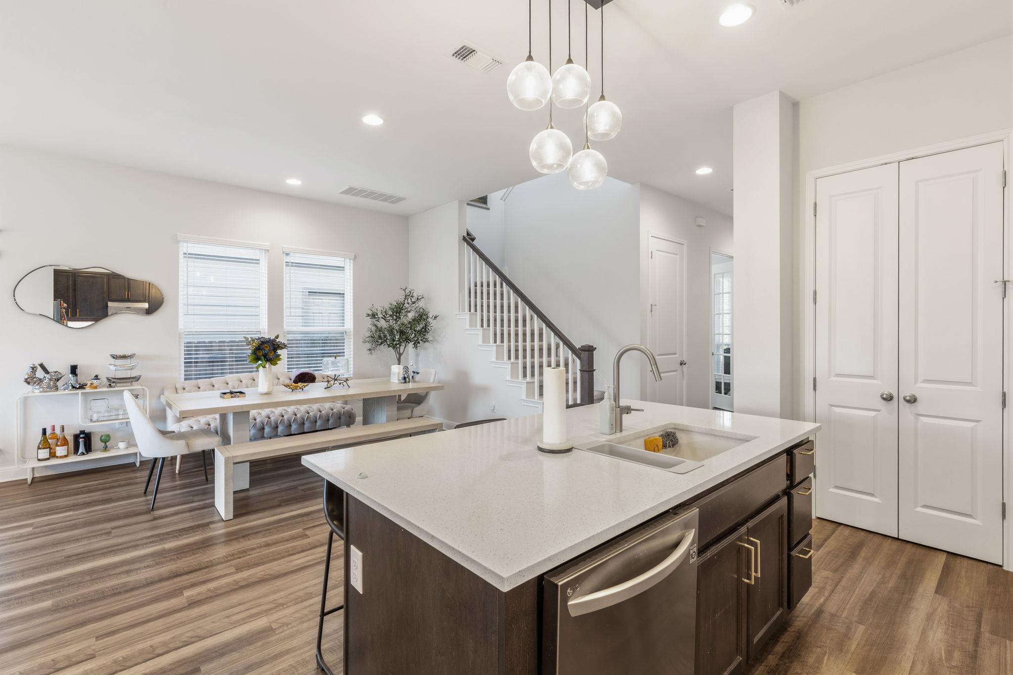 An open floor plan connects the kitchen island to