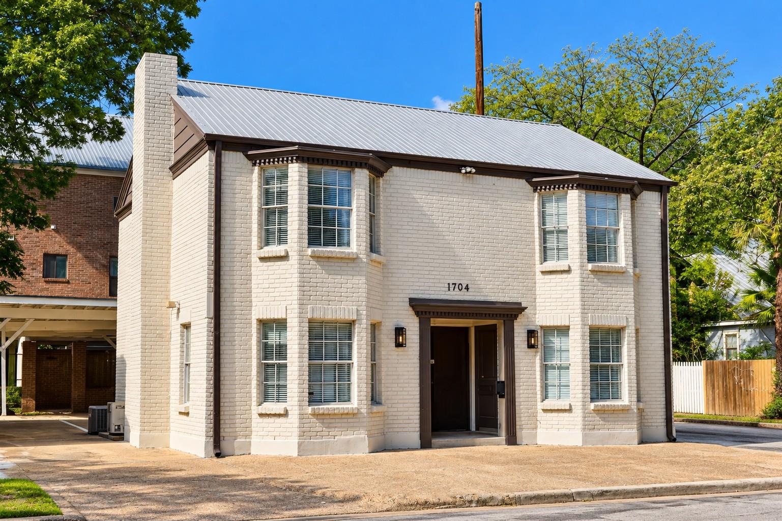 Classic brick architecture features symmetric bay