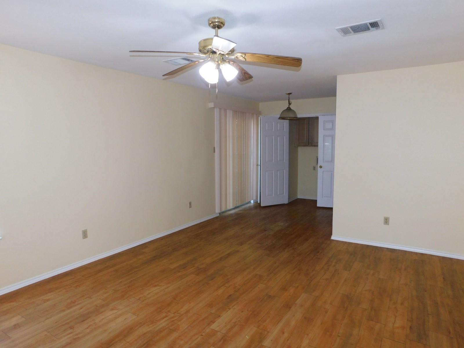 Warm wood flooring grounds this open interior spa