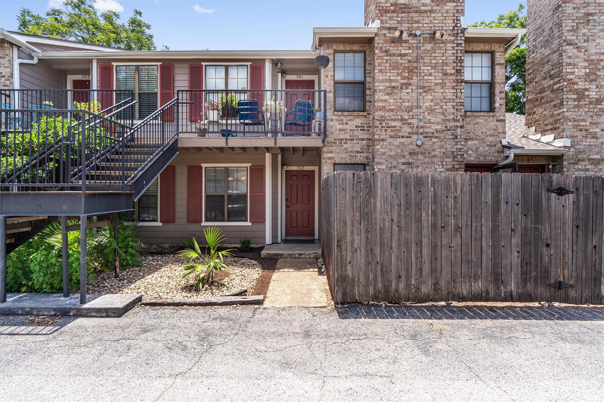 A classic brick exterior with inviting porches an