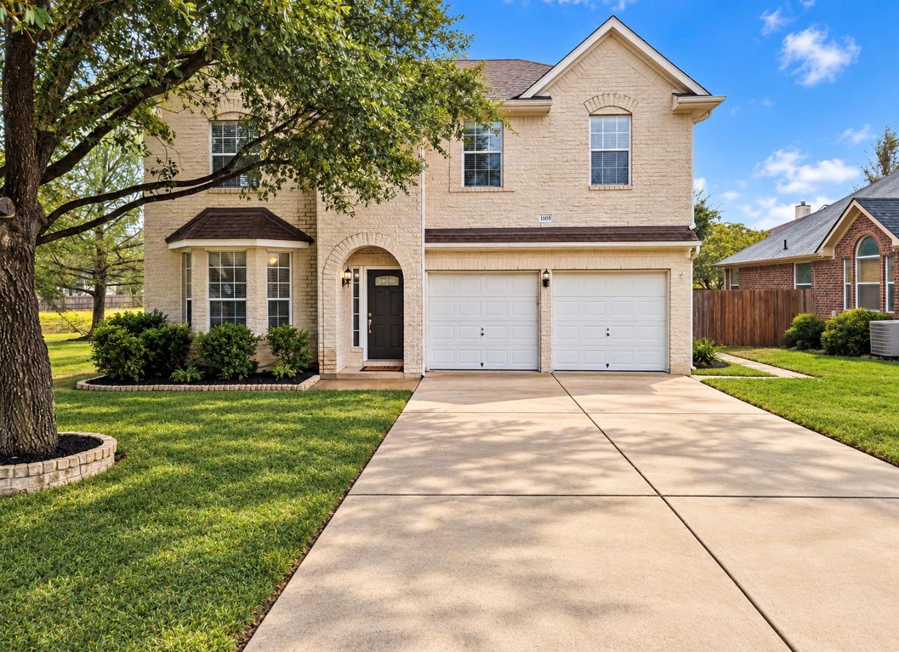 A classic brick exterior fronts this two-story re