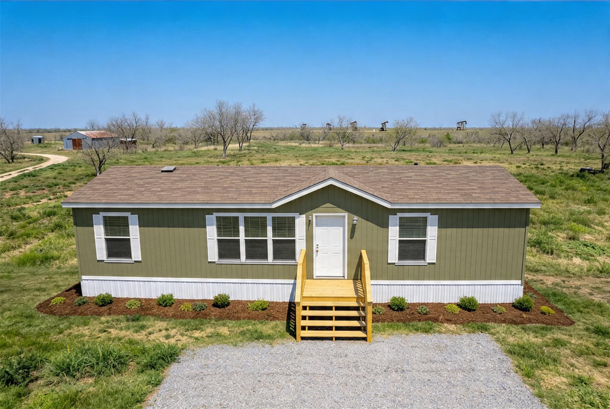 An inviting exterior features a clean gabled roof