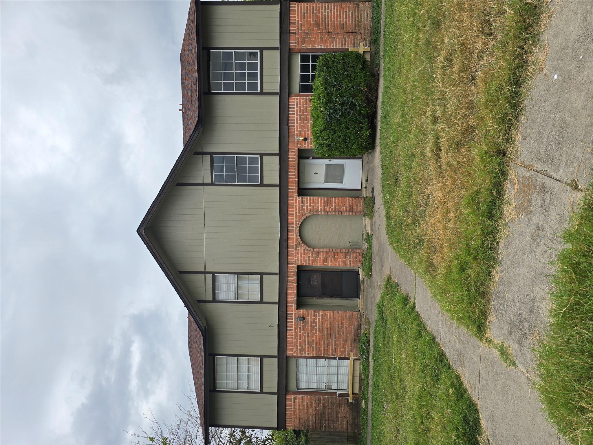 A classic brick and siding exterior features mult