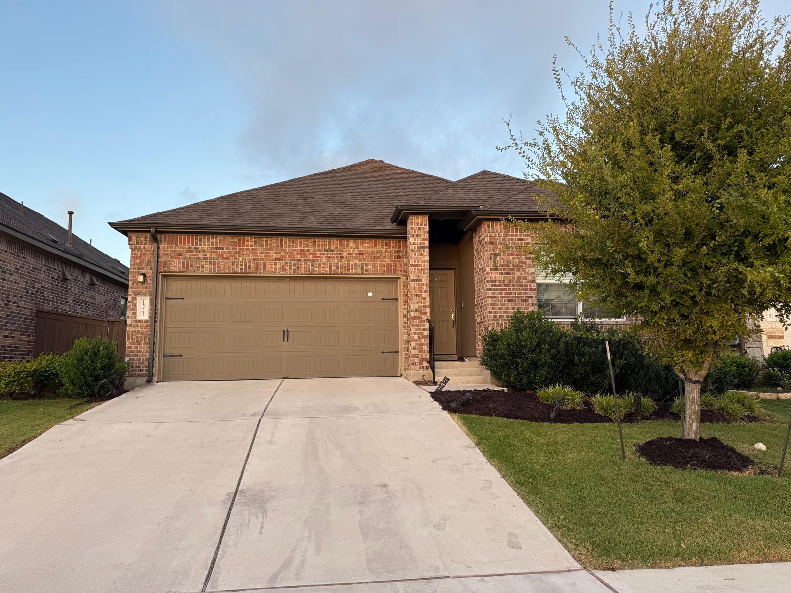 Classic brick exterior meets manicured landscapin