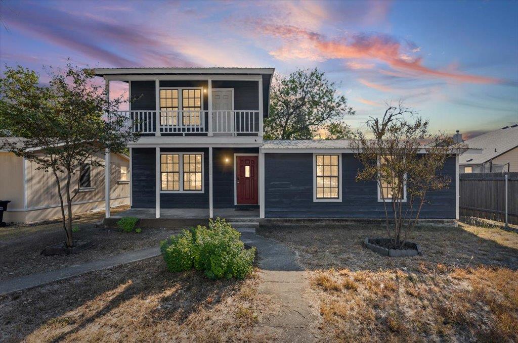View of front of house featuring a metal roof and
