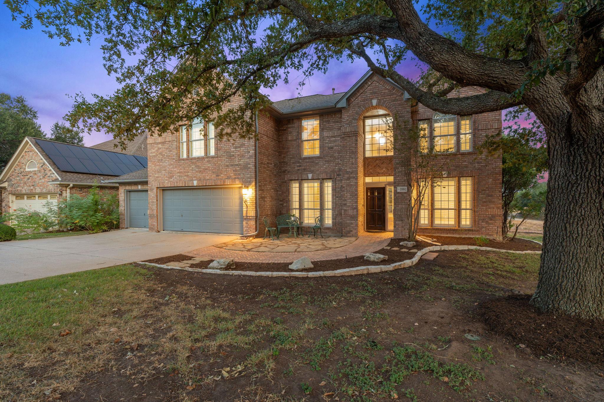 An impressive brick facade and welcoming entry pa