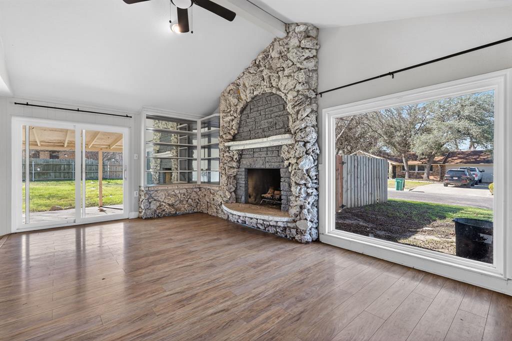 A monumental stone fireplace commands attention i