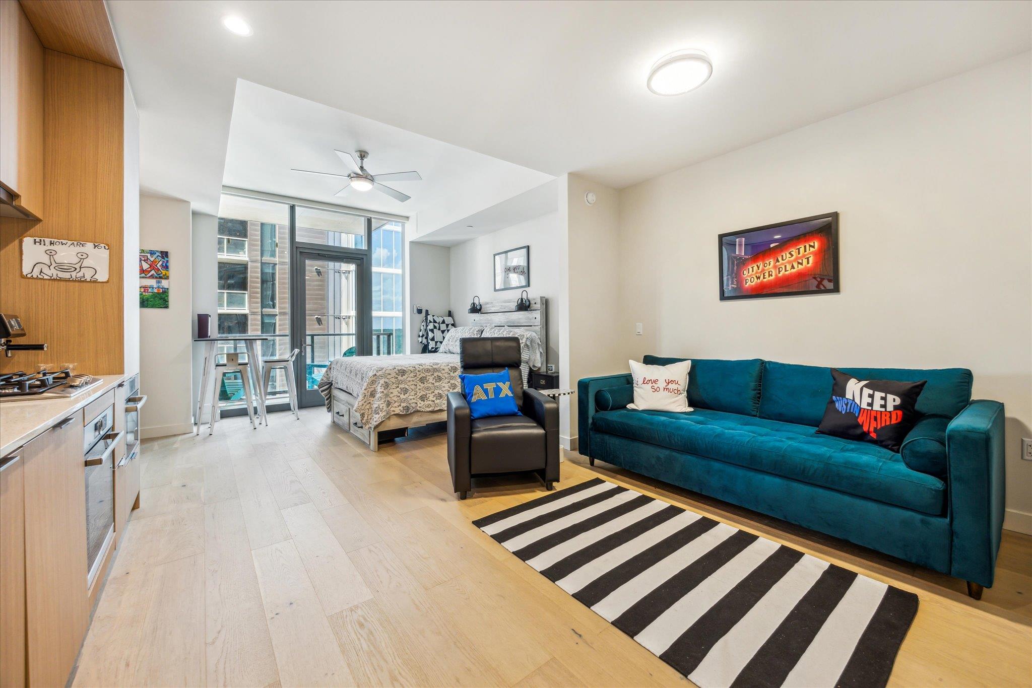 An open floorplan studio showcases light wood flo