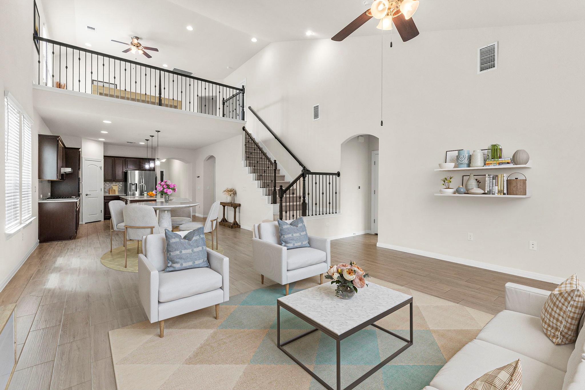 Soaring vaulted ceilings and a dramatic open stai