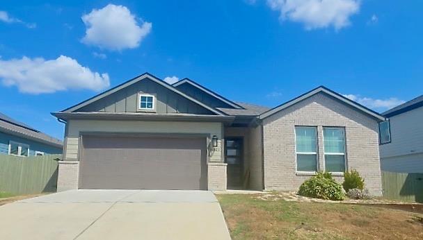 Clean lines and a blend of brick and siding defin