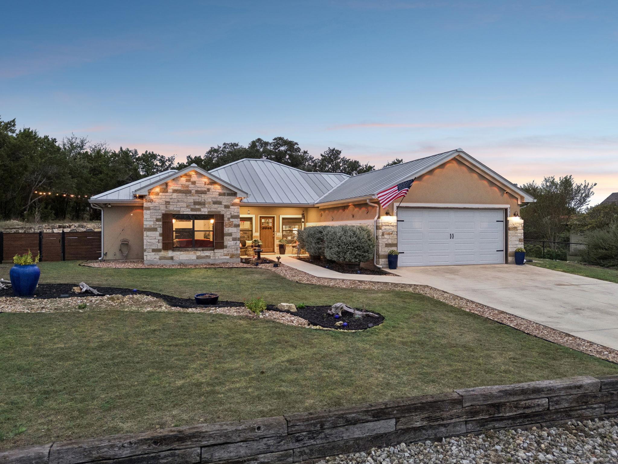 A classic metal roof and textured stone facade de