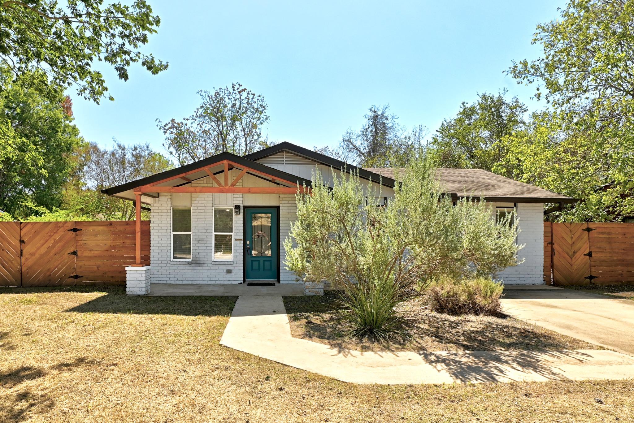 Exposed wooden trusses and brick siding create an
