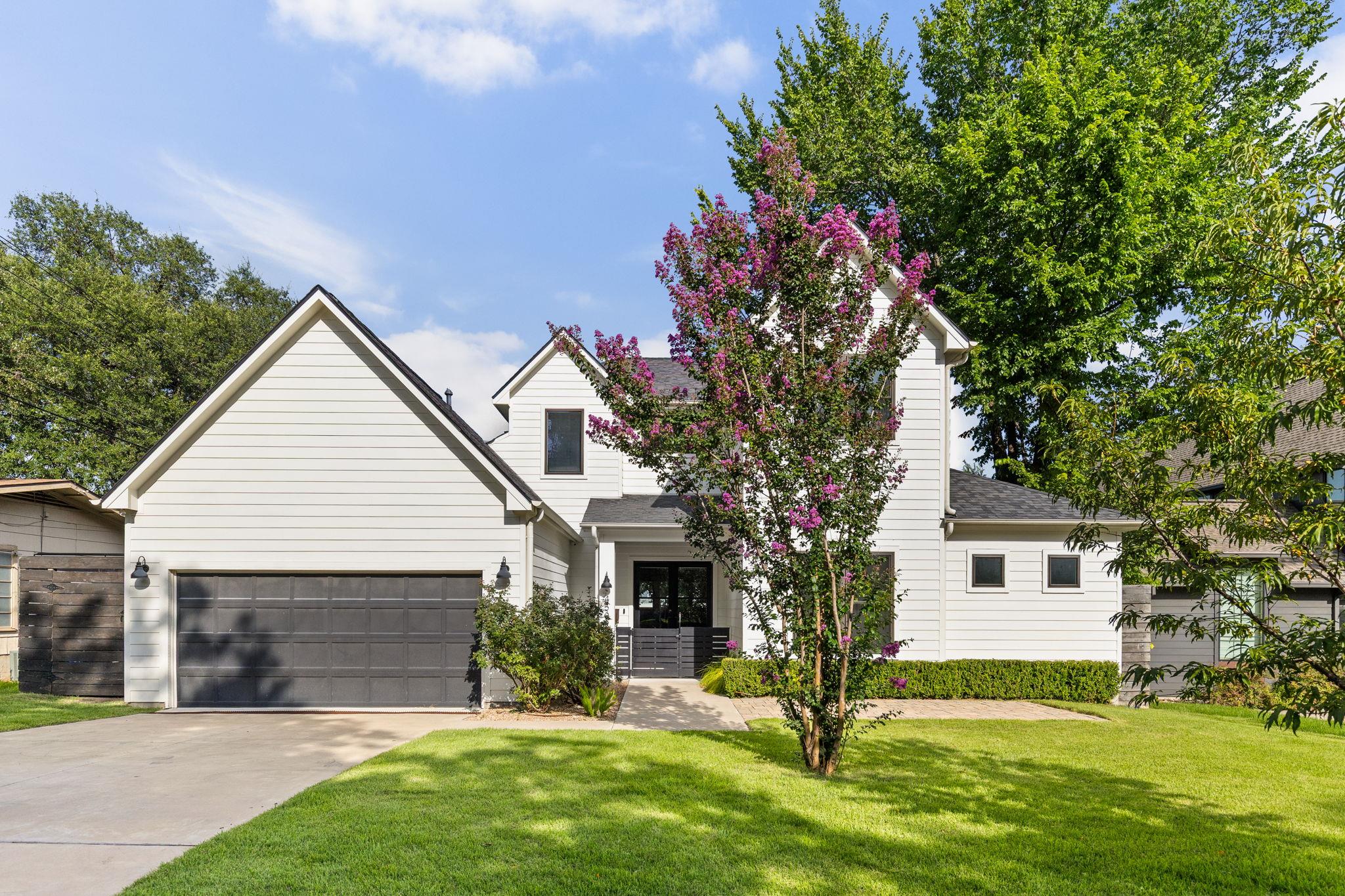 Crisp horizontal siding and a multi-gabled roofli