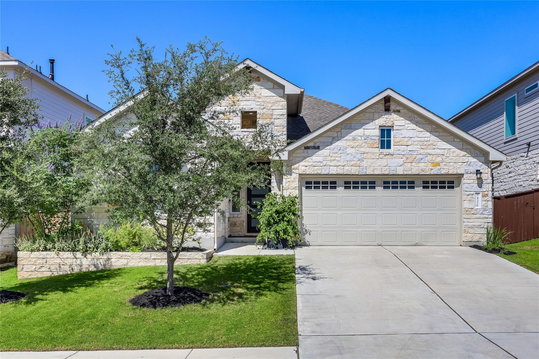 Limestone masonry accents the exterior of this mo