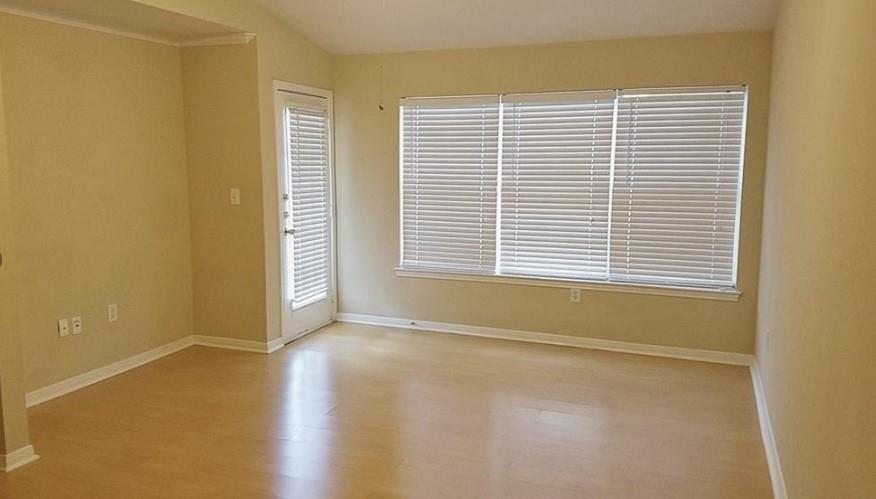 Gleaming wood-look floors anchor this airy living