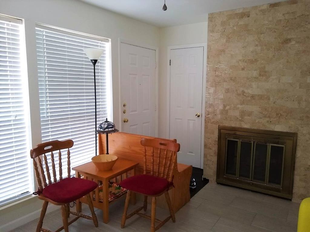 A stone fireplace adds rich texture to this invit