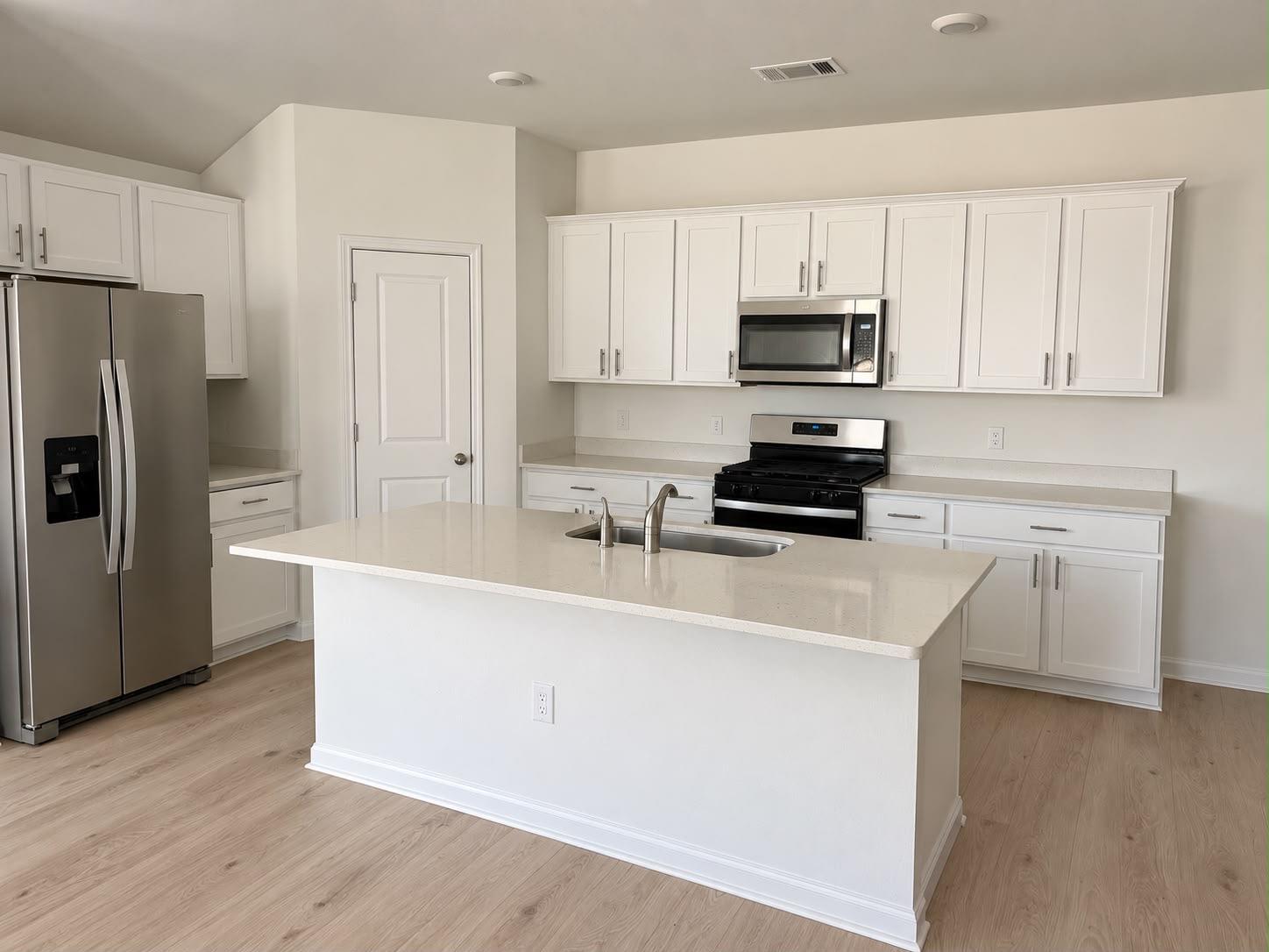 Clean lines and a spacious center island define t