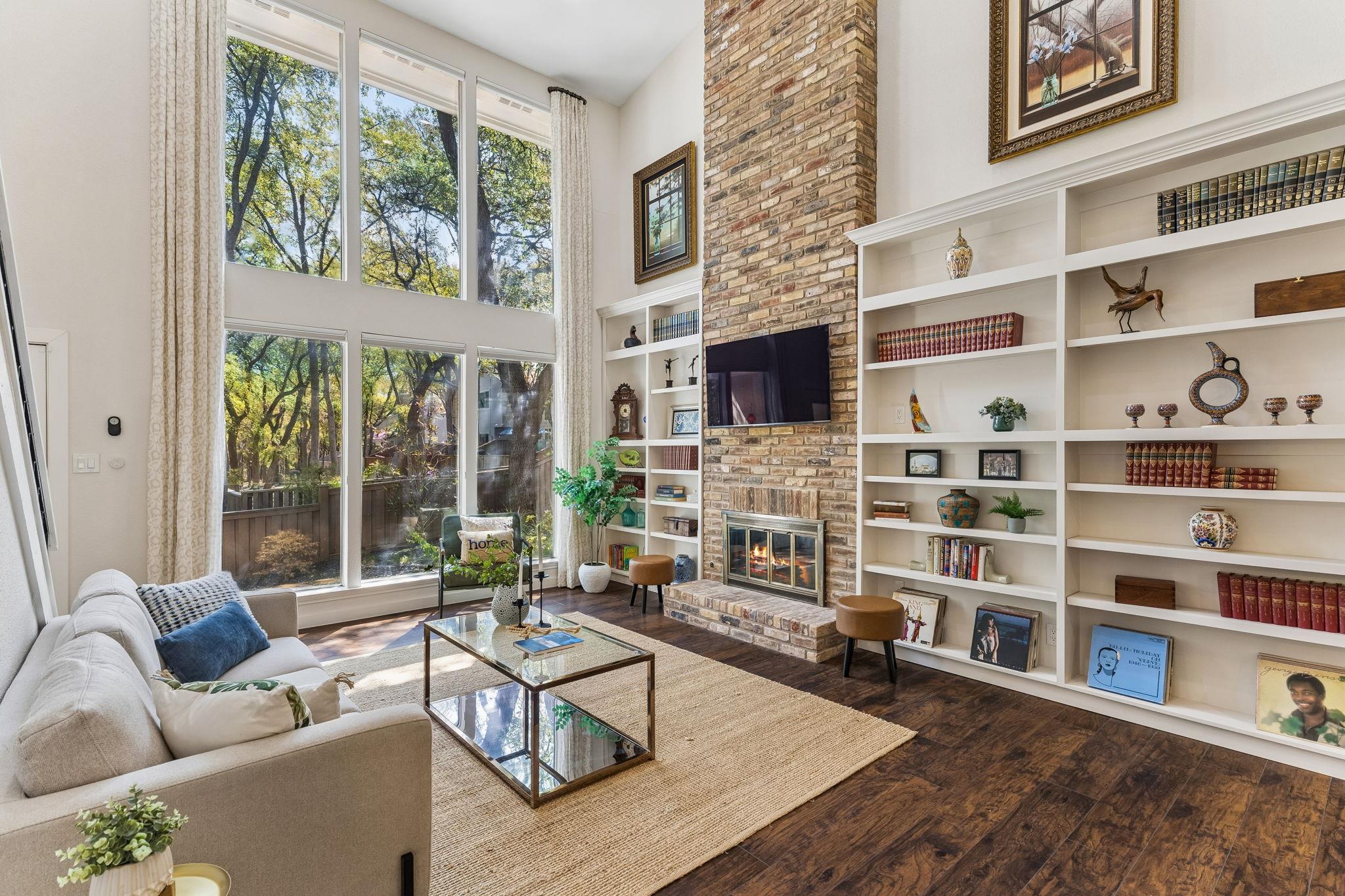 Towering windows and a floor-to-ceiling brick fir