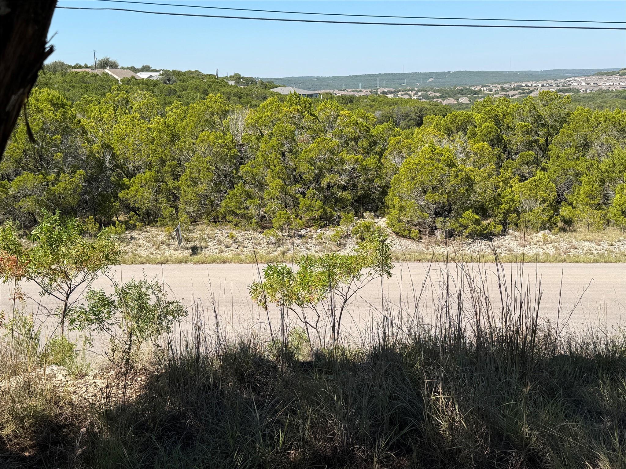 Lush green hillsides and distant valley vistas fr