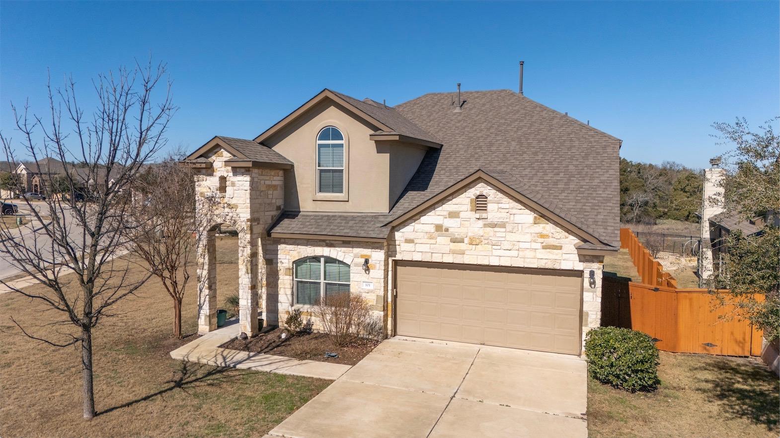 A stone veneer exterior combines with a multi-gab