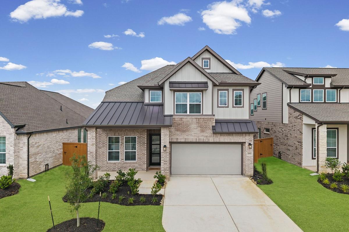 An attractive brick and siding exterior features 