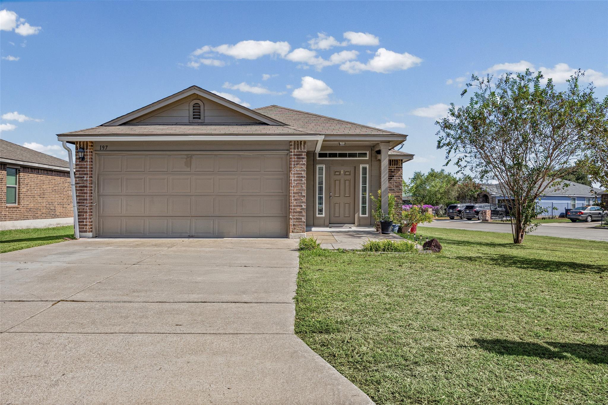 A classic brick exterior accents this single-stor